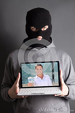 Masked man with computer with picture of woman giving money