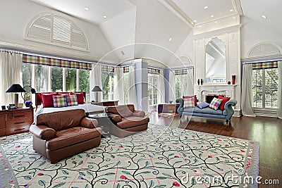 Master bedroom with white fireplace