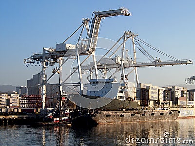 Matson shipping boat is unloaded by cranes in Oakland Harbor