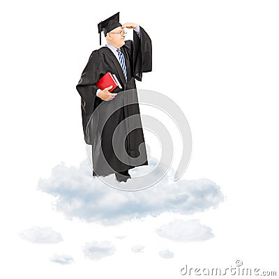 Mature college professor in graduation gown standing on cloud