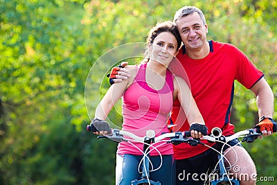 Mature couple on bicycle