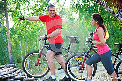 Mature couple on bicycle