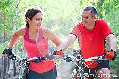 Mature couple on bicycle