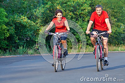 Mature couple on bicycle