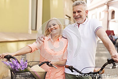 Mature couple on bikes outdoors