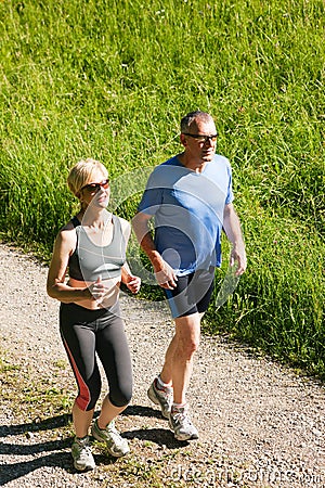 Mature couple doing sport - jogging