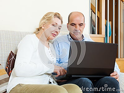 Mature couple with laptop