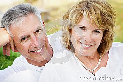 Mature couple smiling and embracing