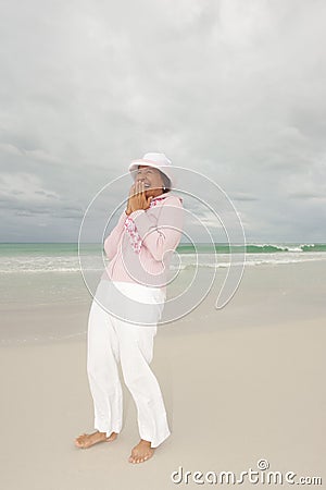 Mature woman active retirement beach