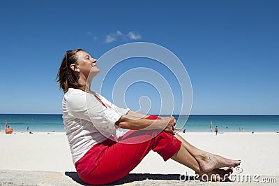 Mature Woman enjoying life at the beach