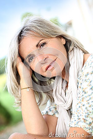 Mature woman with grey hair outdoor