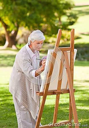 Mature woman painting