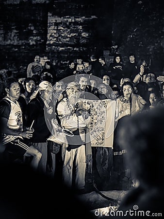 Mayan elder in crowd - Tikal, Guatemala