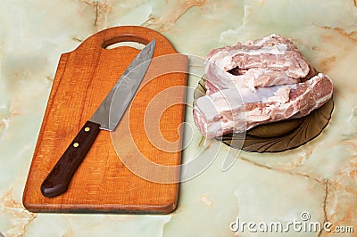 Meat, knife and board