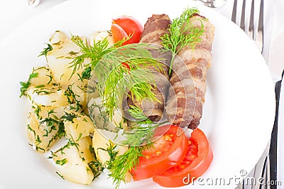 Meat rolls and tomatoes with fennel