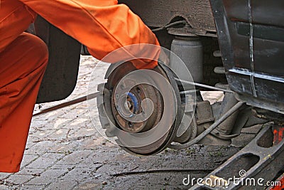 Mechanic changing brake disc