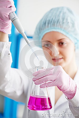 Medical doctor with flask dropper in a laboratory