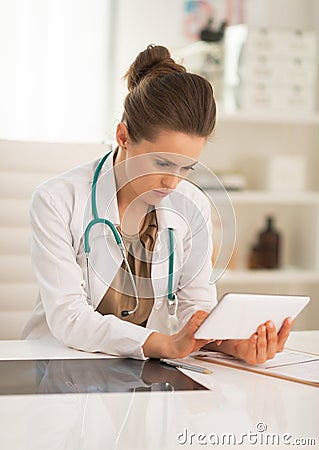 Medical doctor woman using tablet pc