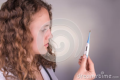 Medical female doctor with thermometer