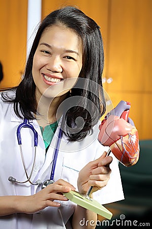 Medical Group studying Cardiologist made heart sign
