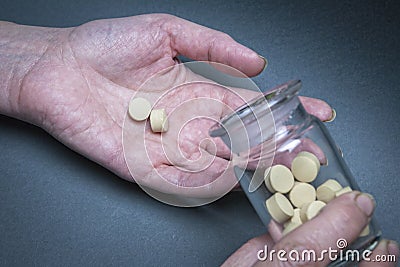 Medical pills in a hand poured