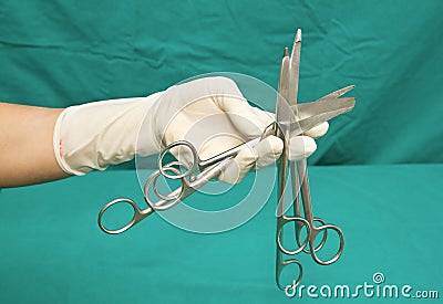 Medical scissors in hand of doctor