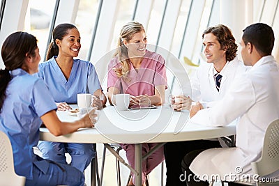 Medical Staff Chatting In Modern Hospital Canteen