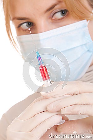 Medical syringe in hands
