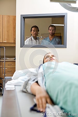 Medical Team Monitoring Patient Getting Xray