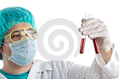 Medical technician examining blood
