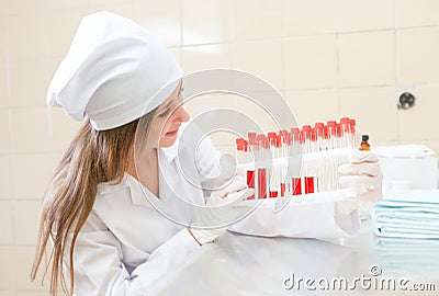 Medical worker with tubes blood tests