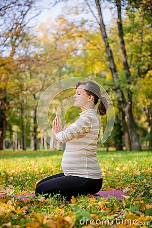 Meditation - pregnant woman outdoor