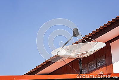 Medium white Satellite Dish on blue sky