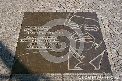 Memorial plate in place of the Berlin Wall with a fragment of the text of U.S. President Ronald Reagan