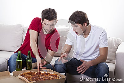 Men friends eating pizza