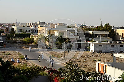 Men play street cricket Karachi Pakistan