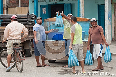 Men purchasing fresh Shrimp from back of truck