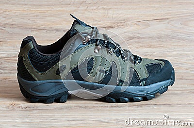 Men s running shoes on wooden background