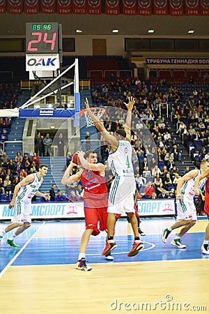 Men from Zalgiris and CSKA Moscow teams play basketball