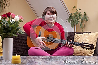Mentally disabled woman playing guitar