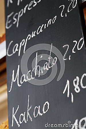 Menu On Blackboard In Coffee Shop