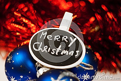 Merry Christmas sign on blue-red sparkling background