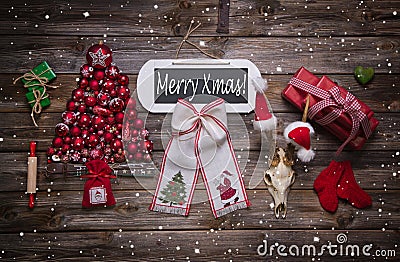 Merry xmas text on wooden sign with classic red christmas decora