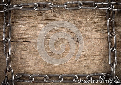 Metal chain on old wood