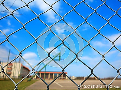 Metal mesh with blur basketball court background