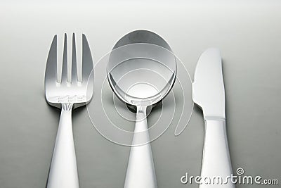 Metal spoon, fork and knife.