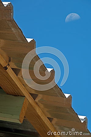 Metal tile house roof and moon