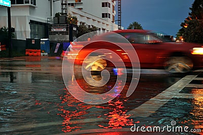 MIAMI BEACH, FL - JULY 18: Cars moving on flooded streets and roads of Miami South Beach after heavy rains