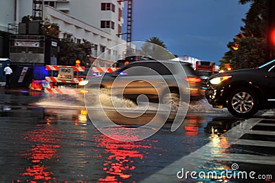 MIAMI BEACH, FL - JULY 18: Cars moving on flooded streets and roads of Miami South Beach after heavy rains