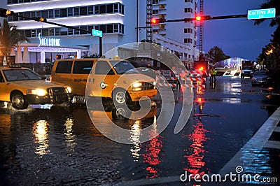 MIAMI BEACH, FL - JULY 18: Cars moving on flooded streets and roads of Miami South Beach after heavy rains